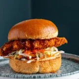 https://eatsy.devbrilliance.com/wp-content/uploads/2026/02/Korean-Chicken-Burger-Just-eat-160x160.webp